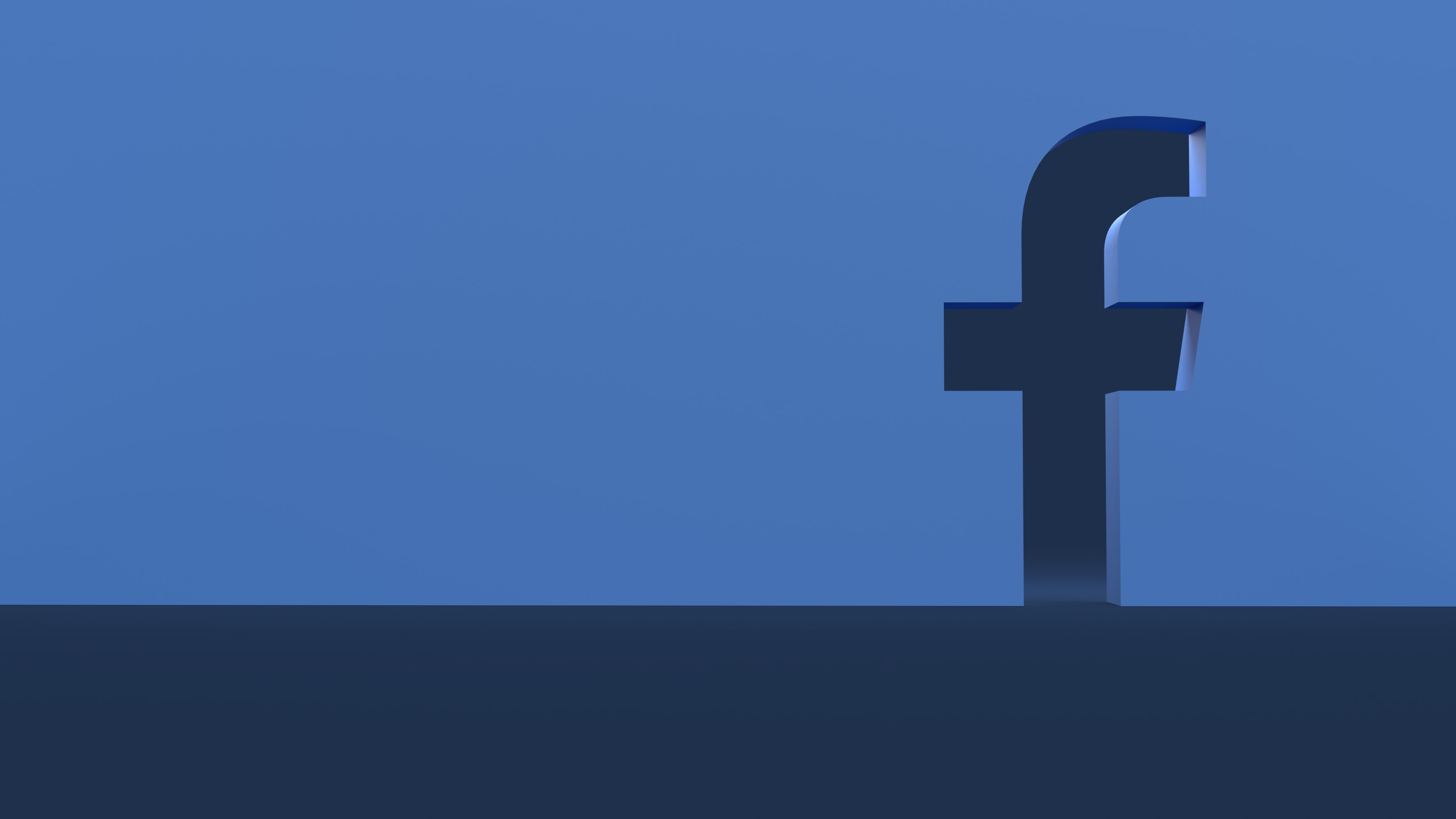 Logo facebooka w ścianie